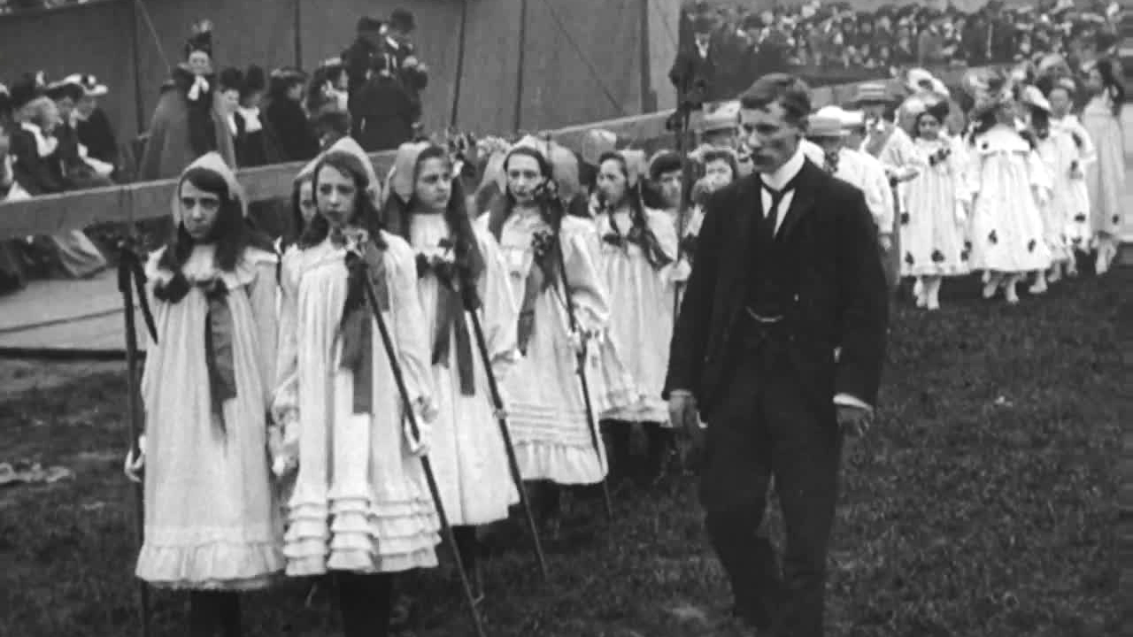 May Day revellers brave a wet and windy day in Edwardian Merseyside.