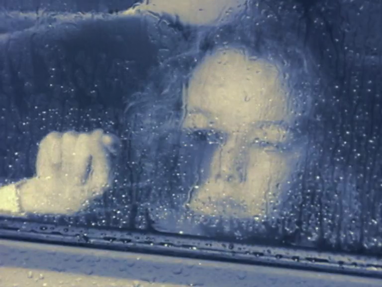 A woman has broken down on the hard shoulder, but has she followed the right advice?