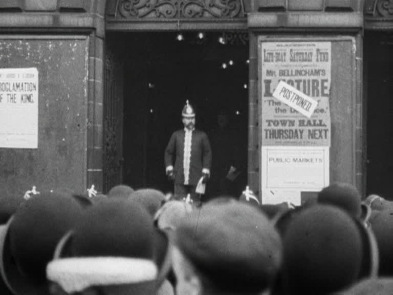 Crowds gather outside theTown Hall to hear the town crier's royal announcement.