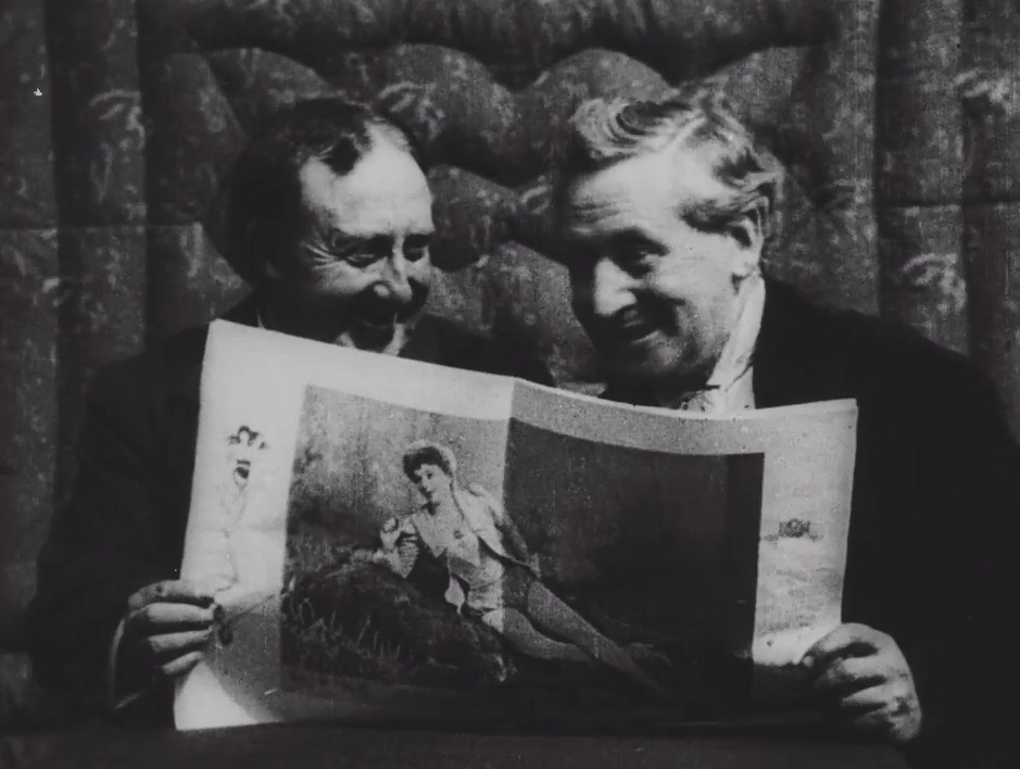 A conversation between two gents perks up when they see a picture of a beautiful actress in a magazine
