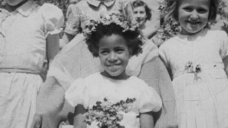 An extraordinary and unexpected snapshot of rural life in wartime in which a young black girl is crowned Queen of the May.