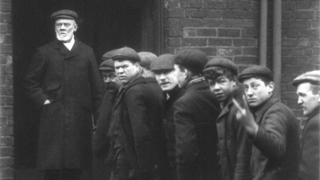 Edwardian workers react to the camera at one of Rotherham's major employers.