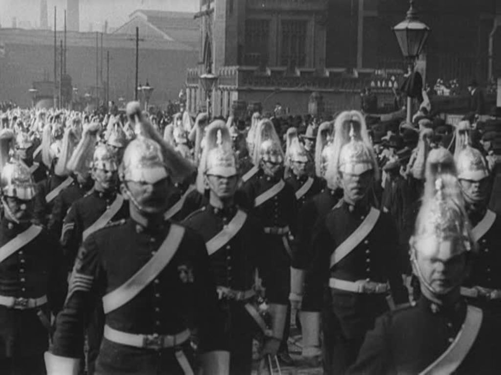 A volunteer cavalry regiment is enthusiastically welcomed home after active service in South Africa.