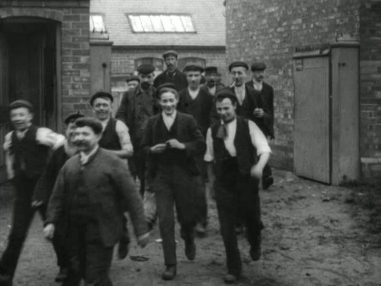An early film showing men and boys leaving a Nottinghamshire metals factory.