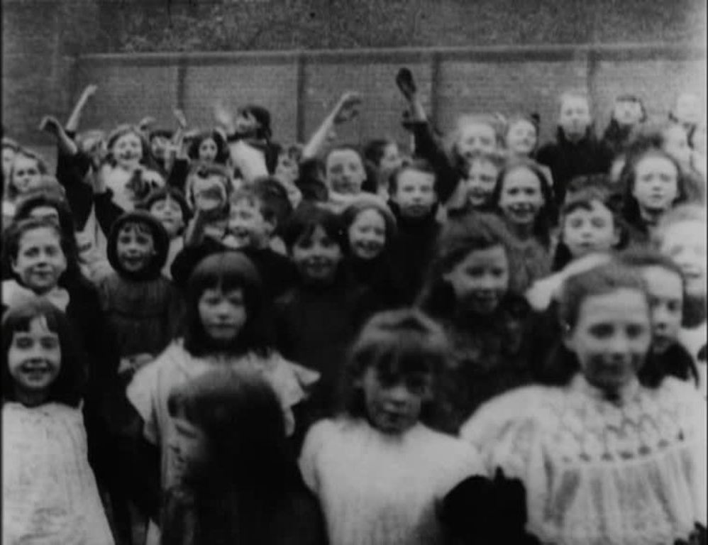 A lively group of Scottish primary-school children plays up for the camera.
