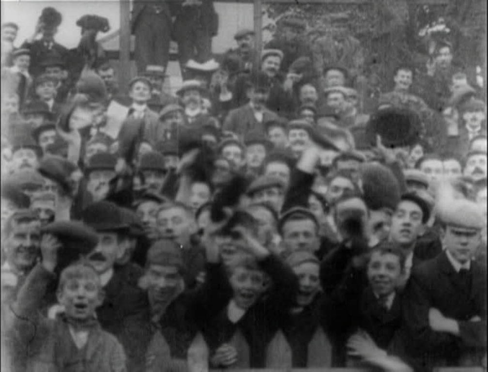 The game is held up for the camera to do a full tour of the cheering crowds at Trent Bridge, Notts County's home until 1910.