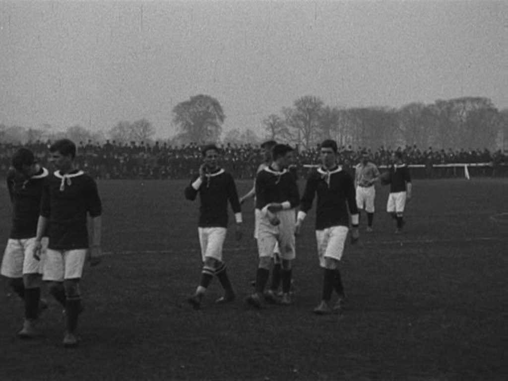 International football action in front of an enthusiastic home crowd in Wrexham.