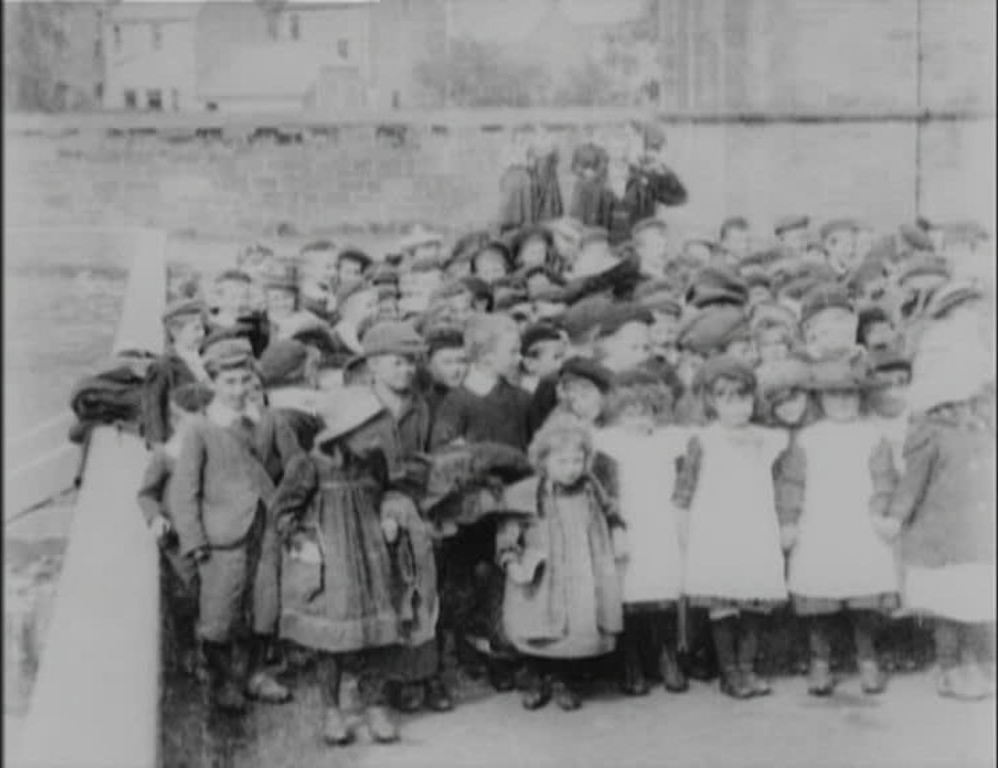 A continuous stream of children dash joyously past the camera in the Scottish town of Annan.