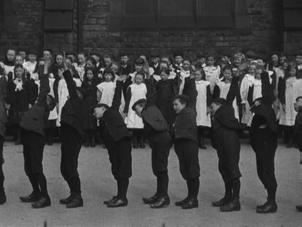 Lancashire children perform physical education exercises in (almost) perfect unison.