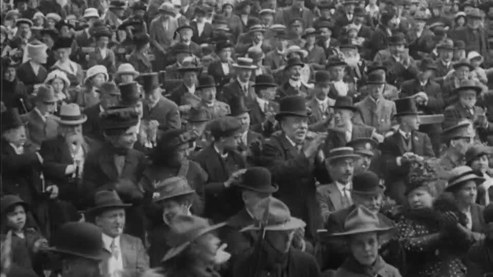 An MP's stirring speech moves the crowd to rapturous applause and the occasional tear at a recruitment rally for Kitchener's New Army.