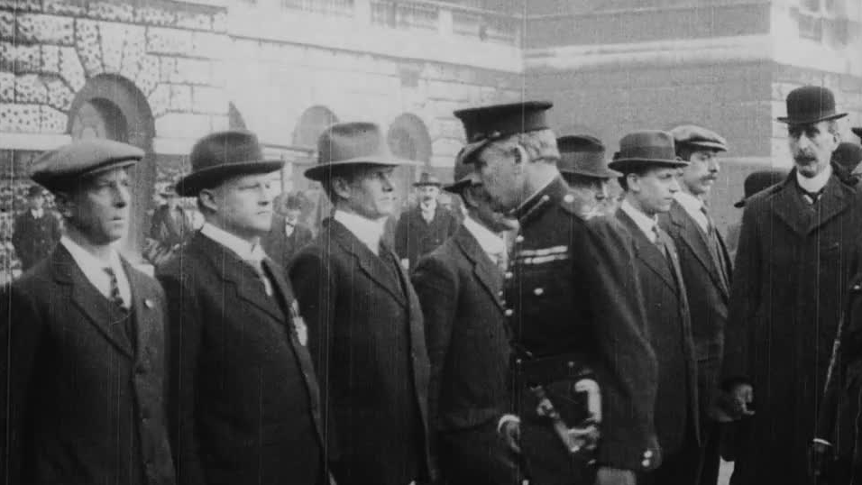 Major-General Francis Lloyd, responsible for the defence of London during WWI, scrutinises a line of volunteers.